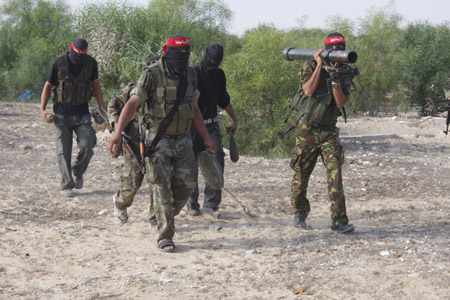 Palestinian militants of the Democratic Front for the Liberation of Palestine (DFLP) participate in a drill in front of the media in the southern Gaza Strip town of Rafah on July 30, 2009.