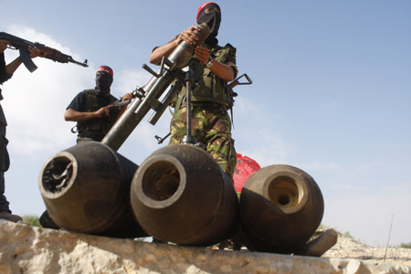 Palestinian militants of the Democratic Front for the Liberation of Palestine (DFLP) participate in a drill in front of the media in the southern Gaza Strip town of Rafah on July 30, 2009.