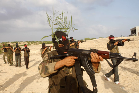 Palestinian militants of the Democratic Front for the Liberation of Palestine (DFLP) participate in a drill in front of the media in the southern Gaza Strip town of Rafah on July 30, 2009.