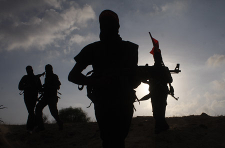 Palestinian militants of the Democratic Front for the Liberation of Palestine (DFLP) participate in a drill in front of the media in the southern Gaza Strip town of Rafah on July 30, 2009.