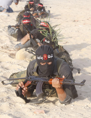 Palestinian militants of the Democratic Front for the Liberation of Palestine (DFLP) participate in a drill in front of the media in the southern Gaza Strip town of Rafah on July 30, 2009.