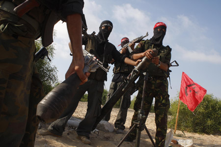 Palestinian militants of the Democratic Front for the Liberation of Palestine (DFLP) participate in a drill in front of the media in the southern Gaza Strip town of Rafah on July 30, 2009.