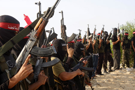 Palestinian militants of the Democratic Front for the Liberation of Palestine (DFLP) participate in a drill in front of the media in the southern Gaza Strip town of Rafah on July 30, 2009.