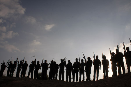 Palestinian militants of the Democratic Front for the Liberation of Palestine (DFLP) participate in a drill in front of the media in the southern Gaza Strip town of Rafah on July 30, 2009.