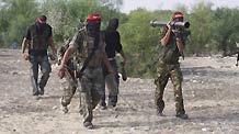 Palestinian militants of the Democratic Front for the Liberation of Palestine (DFLP) participate in a drill in front of the media in the southern Gaza Strip town of Rafah on July 30, 2009.