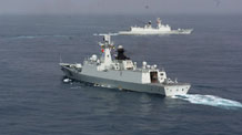 Zhoushan and Xuzhou (front) missile frigates change directions to join the Second Chinese naval escort on the Gulf of Aden, on July 30, 2009. Two frigates and a supply ship from the Chinese navy, on another escort mission to fend off Somali pirates, joined with the second naval escort on Thursday.