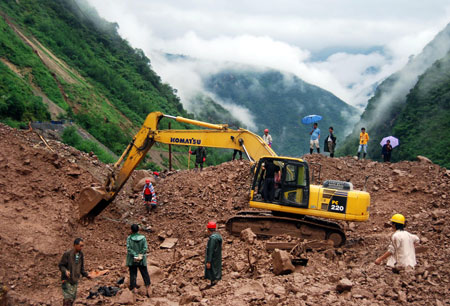 Rescuers search for bodies of the victims in mudslides in Jinyang of southwest China's Sichuan Province, on August 1, 2009. All of the bodies of 9 victims in mudslides caused by heavy rains in Jinyang were found on Saturday. 