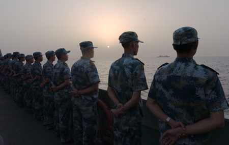 Crew members of the missile frigate 'Zhoushan' of the third Chinese naval flotilla see off the second Chinese naval flotilla in the Gulf of Aden on August 2, 2009. 