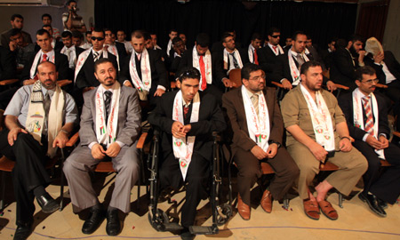 Blind Palestinian grooms are seen during their collective wedding party which involved 80 grooms and brides in Gaza city on August 2, 2009.