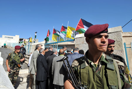 Delegates enter the assembly place of the sixth congress of the Palestinian Fatah movement in the West Bank city of Bethlehem on August 4, 2009.