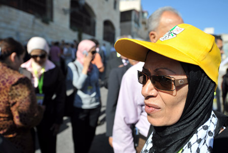 A delegate with a Fatah hat enters the assembly place of the sixth congress of the Palestinian Fatah movement in the West Bank city of Bethlehem on August 4, 2009. 