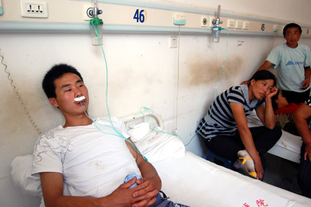 A poisoned man receives treatment in a local hospital in Chifeng City of north China's Inner Mongolia Autonomous Region, on August 5, 2009.