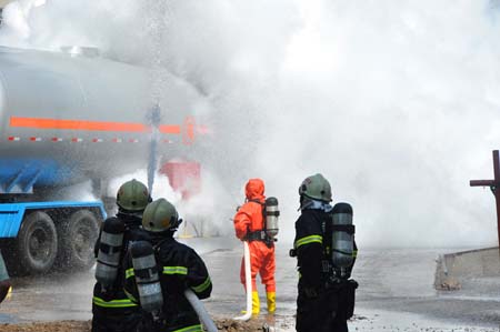 Fire fighters cool the site where an ammonia gas leak occurred at Chifeng Pharmaceutical Factory in Chifeng City, north China's Inner Mongolia Autonomous Region, on August 5, 2009.