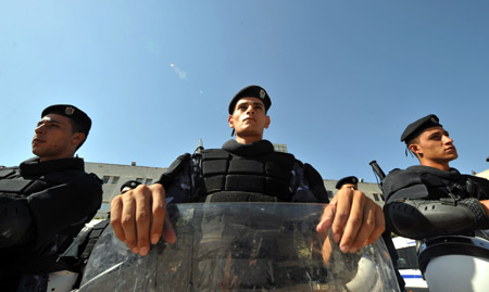 Palestinian policemen guard near the assembly place of the sixth congress of the Palestinian Fatah movement in the West Bank city of Bethlehem, on August 4, 2009.