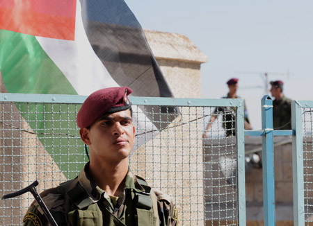 Palestinian policemen guard near the assembly place of the sixth congress of the Palestinian Fatah movement in the West Bank city of Bethlehem, on August 4, 2009.