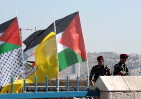 Palestinian policemen guard near the assembly place of the sixth congress of the Palestinian Fatah movement in the West Bank city of Bethlehem, on August 4, 2009.