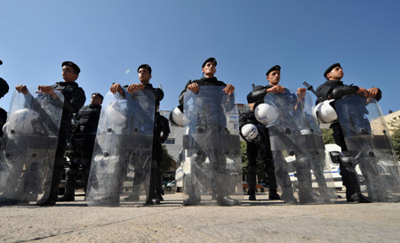 Palestinian policemen guard near the assembly place of the sixth congress of the Palestinian Fatah movement in the West Bank city of Bethlehem, on August 4, 2009.