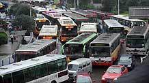 Vehicles are blocked during rush hour in China's Chongqing Municipality, on August 4, 2009. Heavy rain hit Chongqing on Tuesday causing traffic jam and the closure of highways. A total of 379,900 people are plagued by the strong rainfalls.