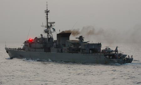 Saudi Arab's Abha missile frigate say hello via light signal to the Chinese navy's Zhoushan missile frigate on the Gulf of Aden, on August 4, 2009. Two frigates and a supply ship from the Chinese navy is on their escort mission to fend off Somali pirates on the Gulf of Aden.
