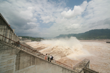 The photo taken on August 6, 2009 shows the running torrents passing the sluice of the Three Gorges Dam on the Yangtze River in Yichang City of central China's Hubei Province. 