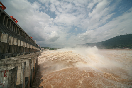 The photo taken on August 6, 2009 shows the running torrents passing the sluice of the Three Gorges Dam on the Yangtze River in Yichang City of central China's Hubei Province.