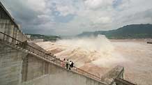 The photo taken on August 6, 2009 shows the running torrents passing the sluice of the Three Gorges Dam on the Yangtze River in Yichang City of central China's Hubei Province.