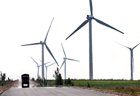 Huge turbines of wind power plants are pictured in Hinggan League (or prefecture) of north China's Inner Mongolia Autonomous Region on Aug. 7, 2009. Inner Mongolia, covering 1.18 million square kilometers of land, has boasted more than 3 million kilowatts of wind power, the largest of its kind in China. (Xinhua/Wang Song)