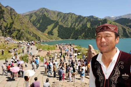 A local herdsman waits for tourists who are to visit his home, at the Tianchi Lake in the Tianshan Mountains of northwest China&apos;s Xinjiang Uygur Autonomous Region, on August 8, 2009. 