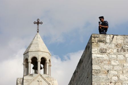 A soldier of the Palestinian security forces stands guard at the Manger Square near the site of the election for Fatah movement's central committee and revolutioary council, in the West Bank city of Bethlehem on August 9, 2009.