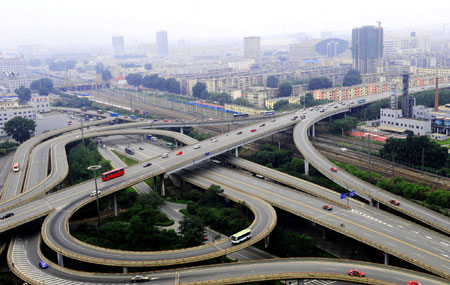 The photo taken on August 2, 2009 shows city traffic of Anshan, northeast China's Liaoning Province. As one of the most important iron and steel producing base in China, Angang has been growing up with the nation since it was set up in 1949.