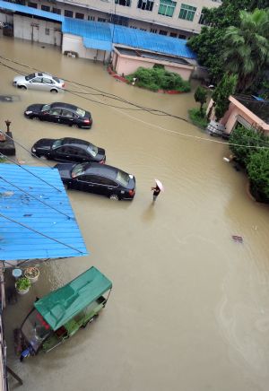 Cars are immerged in flood in Cangnan, east China's Zhejiang Province, on August 10, 2009.