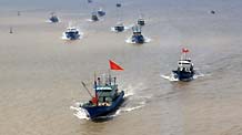 A group of fishboats leave their shelter port for fishing in Zhoushan, east China's Zhejiang Province, on August 11, 2009. Nearly 10,000 fishboats came out for fishing Tuesday after the alert of Typhoon Morakot was lift.