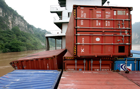 This photo taken on August 11 shows containers on the Yangtze River. Search work went on Tuesday for 62 containers, some carrying dangerous chemicals, that fell into the Yangtze River on Monday night.