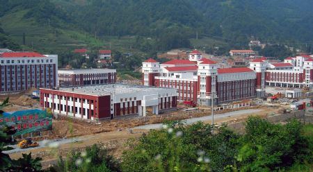 A panoramic view of the campus of Tianjin High Middle School is seen in the picture taken in Lueyang, northwest China&apos;s Shaanxi province, on August 12, 2009. The high middle school with its designed capacity of 3,000 students was donated by the people and government of North China&apos;s Tianjin Municipality after the serious earthquake hit southwest China&apos;s Sichuan province, northwest China&apos;s Shaanxi and Gansu provinces on May 12, 2008. 