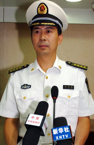 Senior Colonel of the Chinese Navy Li Xinfeng, spokesman for China&apos;s third naval escorting mission, addresses a news conference about the mission&apos;s operations against pirates, aboard China&apos;s &apos;Zhoushan&apos; missile frigate in the Gulf of Aden, on August 12, 2009. 