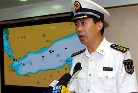 Senior Colonel of the Chinese Navy Li Xinfeng, spokesman for China&apos;s third naval escorting mission, addresses a news conference about the mission&apos;s operations against pirates, aboard China&apos;s &apos;Zhoushan&apos; missile frigate in the Gulf of Aden, on August 12, 2009. 