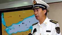 Senior Colonel of the Chinese Navy Li Xinfeng, spokesman for China's third naval escorting mission, addresses a news conference about the mission's operations against pirates, aboard China's 'Zhoushan' missile frigate in the Gulf of Aden, on August 12, 2009.