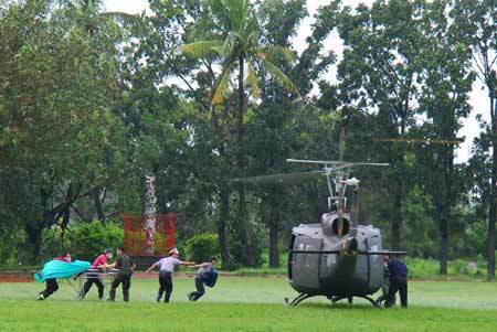 A helicopter prepares to take off to rescue trapped residents in Kaohsiung county of south China's Taiwan Province, on August 11, 2009. Helicopters rescued many residents trapped by flood and mudslide caused by Typhoon Morakot on Tuesday morning as the weather became clear. The death toll in Taiwan after typhoon Morakot swept across the island surged to 103 as of 9 PM on Wednesday after rescuers found 32 bodies in southern Kaohsiung County, local media reported.  