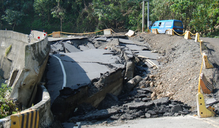 The road destroyed by mudslides and flood is seen in Jiasian Township, Kaohsiung County, southeast China's Taiwan, on August 15, 2009.
