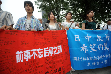 Japanese pacifists attend an assembly to commemorate the victims at the Memorial Hall of the Victims in Nanjing Massacre By Japanese Invaders in Nanjing, capital of east China's Jiangsu Province, on August 15, 2009. Chinese people and Japanese pacifists attended commemorating ceremonies on Aug. 15, the 64th anniversary of the victory day of the Chinese anti-Japanese war. 