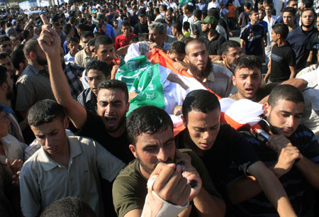 Palestinians attend the funeral of Hamas security forces killed in gunbattles with an Islamic redical group in Rafah, southern Gaza Strip, on August 15, 2009. 