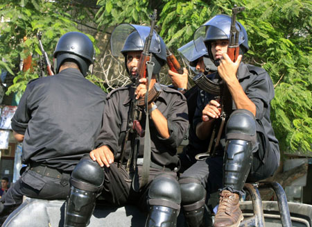 Members of Hamas security forces guard the funeral of the Hamas security forces killed in gunbattles with an Islamic redical group in Rafah, southern Gaza Strip, on August 15, 2009.