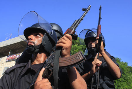 Members of the Hamas security forces guard the funeral of the Hamas security forces killed in gunbattles with an Islamic redical group in Rafah, southern Gaza Strip, on August 15, 2009.