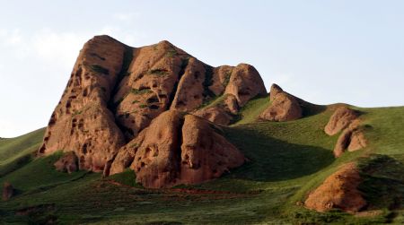 Photo taken on August 14, 2009 shows a part of scenery of the Huoshizhai National Geopark in northwest China's Ningxia Hui Autonomous Region. The geopark is famous for its unique 'Danxia' landform. Danxia, which means 'rosy cloud', is a kind of special landform formed from reddish sandstone that has been eroded over time into a series of mountains surrounded by curvaceous cliffs and many unusual rock formations. 