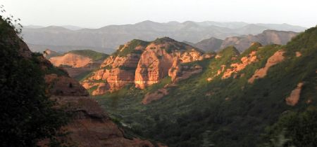 Photo taken on August 14, 2009 shows a part of scenery of the Huoshizhai National Geopark in northwest China's Ningxia Hui Autonomous Region. The geopark is famous for its unique 'Danxia' landform.
