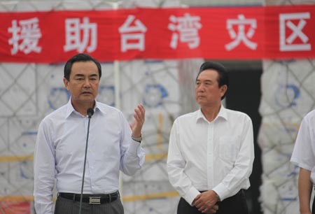 Wang Yi, director of the Taiwan Work Office of the Communist Party of China (CPC) Central Committee, expresses his condolence on Taiwan people's loss during a start sending ceremony at the Beijing Capital International Airport, China, on August 18, 2009.