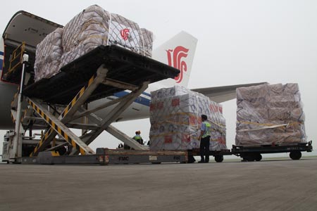 Working staff examine the relief supplies at the Beijing Capital International Airport, China, on August 18, 2009.