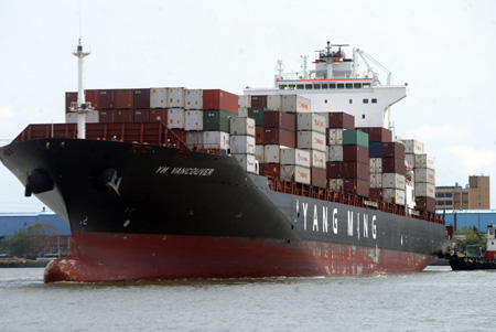 A cargo ship loaded with 100 makeshift houses in initial relief aid offered by mainland China docks at Kaohsiung port in southeast China's Taiwan Province, on August 18, 2009. The batch of the relief aid would be rushed to the Typhoon Morakot seriouly-striken areas in the island, which left more than 160 people dead and heavy property losses.