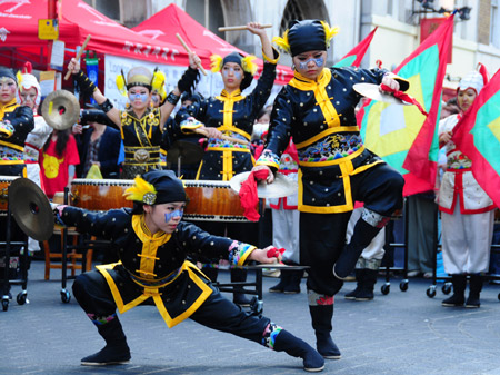 Members of an art troupe from Taiwan's Shih Chien University perform at a donation raising event for Taiwan's typhoon victims in Chinatown in London on August 18, 2009. Overseas Chinese groups in London gathered on Tuesday at London's Chinatown for a donation raising for the people affected by typhoon Morakot in southeast China's Taiwan Province. [