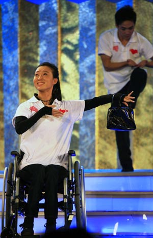 Chinese dancer Liu Yan (front) performs during a television fundraiser in Beijing, capital of China, on August 20, 2009. A star-studded television fundraiser on the Chinese mainland on Thursday raised more than 310 million yuan (about US$45 million) for victims of Taiwan's deadliest typhoon in half a century.